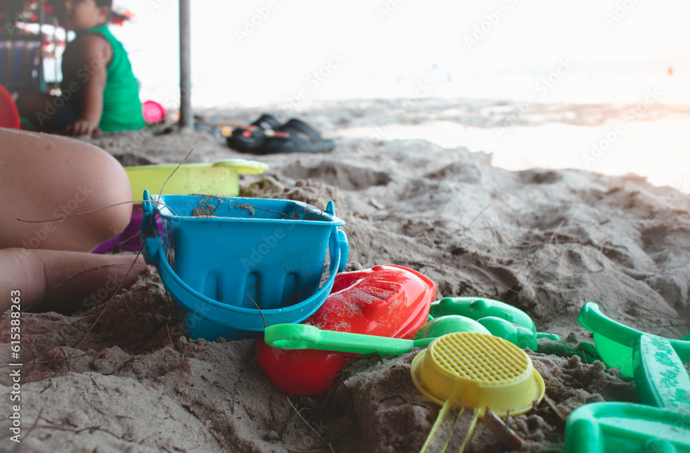 children's toys on the beach shovel toys for children playing on the sea shore travel on the beach concept children's toys on the beach shovel toys for children playing on the sea shore travel on the beach concept
