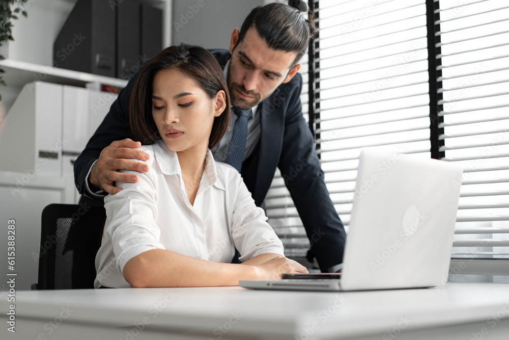 Sexual harassment at workplace concept. Attractive Asia woman being