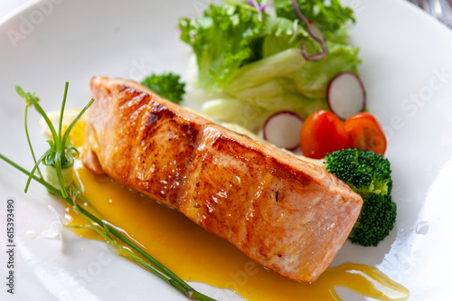 Experience the perfection of Pan-Seared Salmon: crispy, moist, and bursting with flavors. Indulge in this culinary masterpiece and elevate your dining pleasure.