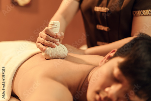 Obraz na plátne Selective focus, Herbal compress on hand of masseur