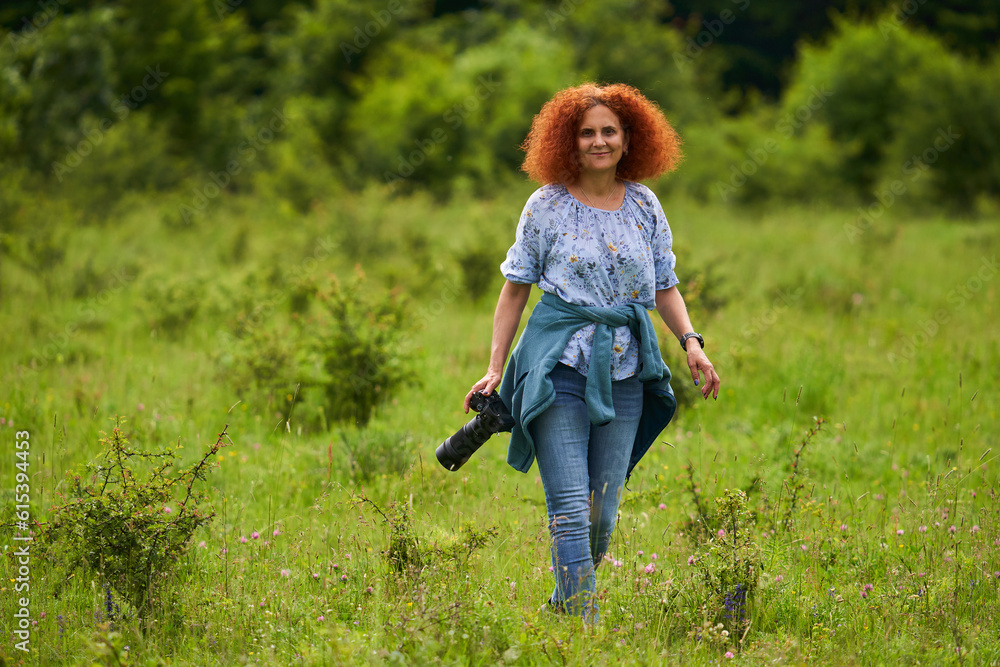 Woman nature photographer with camera