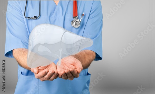 Hand of doctor holding human organ in hand