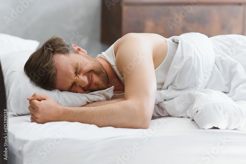 Obraz na plátně Young man in bed , trying to sleep