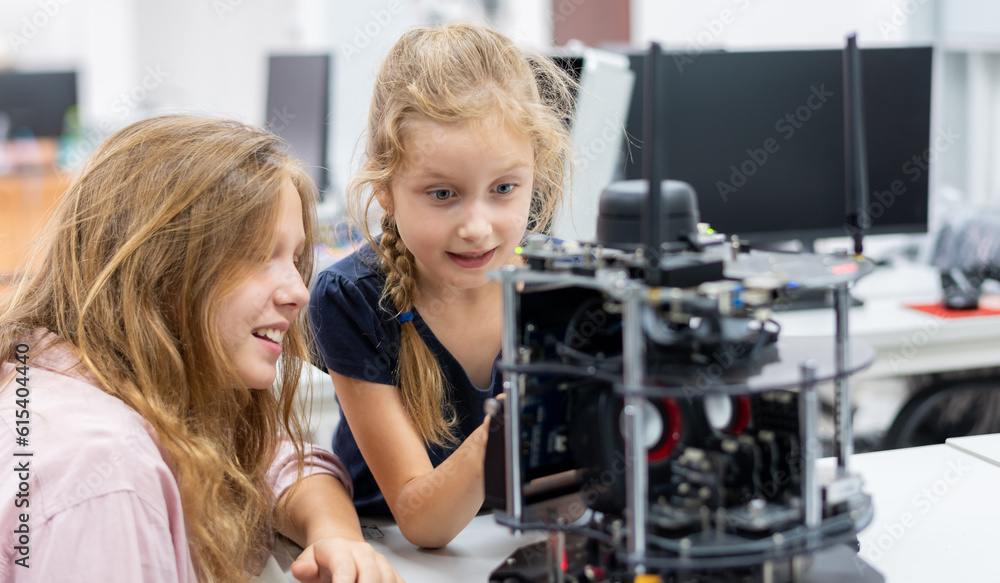 Machine Learning Robotics Class Group Kid teen child enjoy Machine Learning Robot arm is Moving Under ...