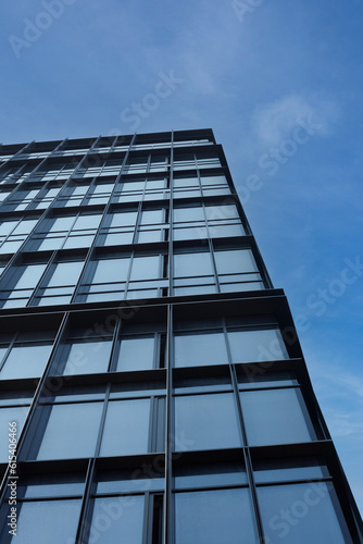 Angle view on the modern business center with clean blue sky