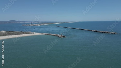 Aerial seascape view of Ilha deserta (lighthouse island), one of the barrier islands that protect the Ria Formosa natural park, in Algarve Tourism Destination Region, in Portugal south coast photo