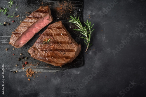 Grilled steak on concrete background