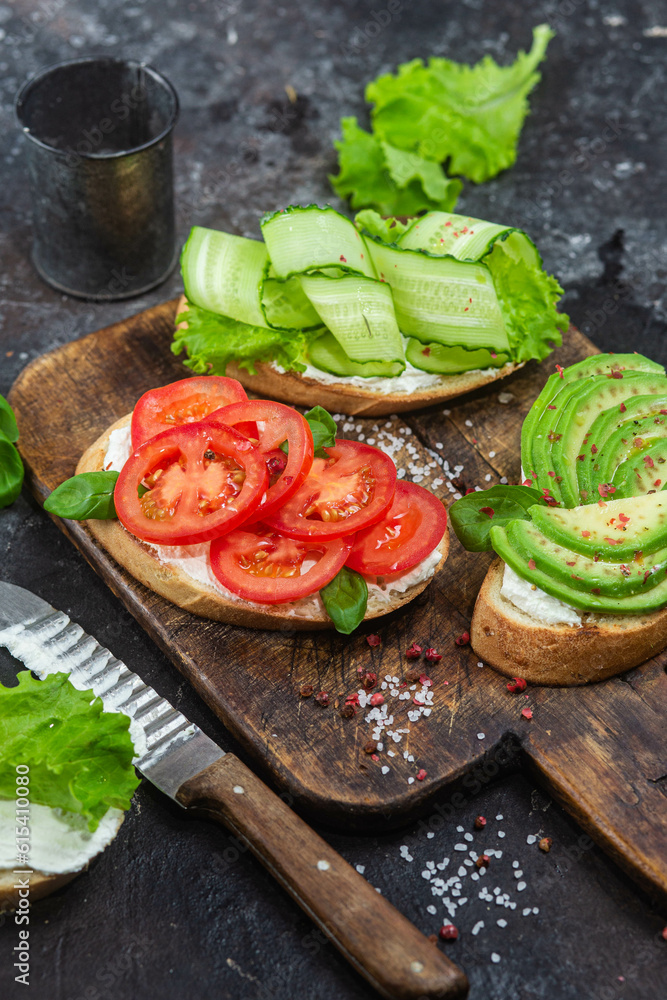 Sandwiches with tomato, avocado and cucumber Sandwiches with tomato, avocado and cucumber