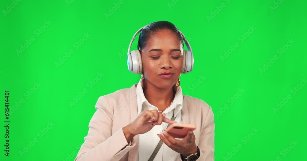 Headphones, cellphone and woman in a studio with green screen listening to music, playlist or album dancing. Happy, technology and female model doing a dance to song isolated by chroma key background Headphones, cellphone and woman in a studio with green screen listening to music, playlist or album dancing. Happy, technology and female model doing a dance to song isolated by chroma key background
