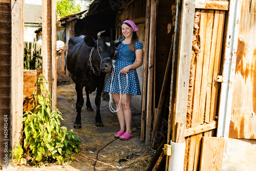 Portrait of woman farmer smiling in the cow farm