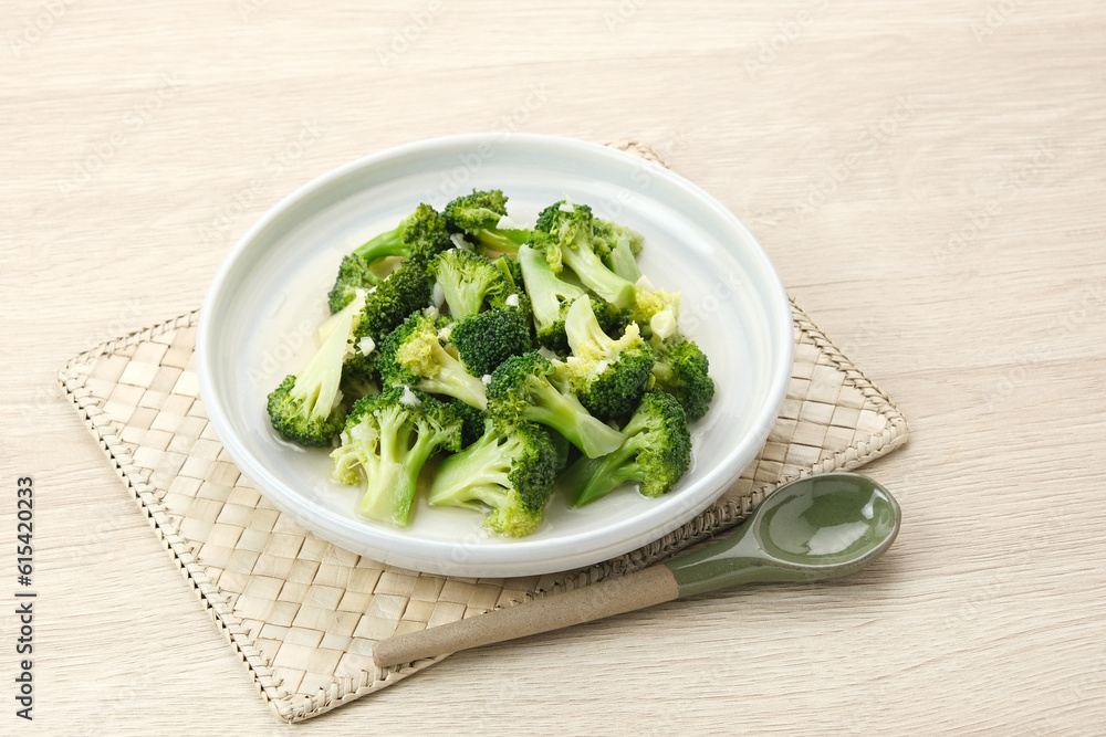 Stir fried broccoli or ca brokoli, Indonesian food, served in a bowl.
Stir fried broccoli or ca brokoli, Indonesian food, served in a bowl.