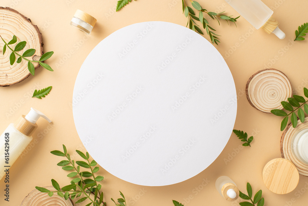 Eco friendly cosmetics concept. Top view photo of empty circle surrounded by cosmetic containers, eucalyptus and fern foliage on isolated beige background with copyspace Eco friendly cosmetics concept. Top view photo of empty circle surrounded by cosmetic containers, eucalyptus and fern foliage on isolated beige background with copyspace