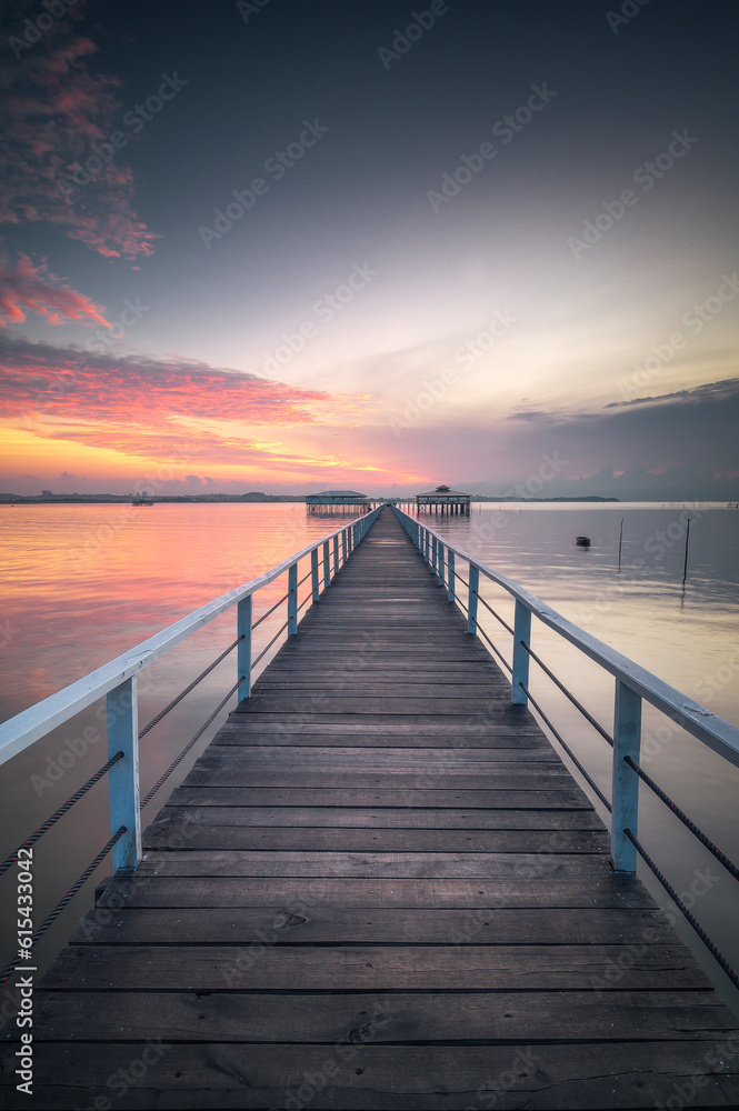 Wooden jetty on the sea at beautiful sunset, Indonesia