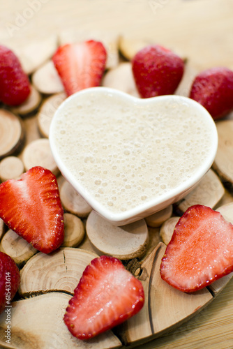 Fresh strawberries with sauce on a board