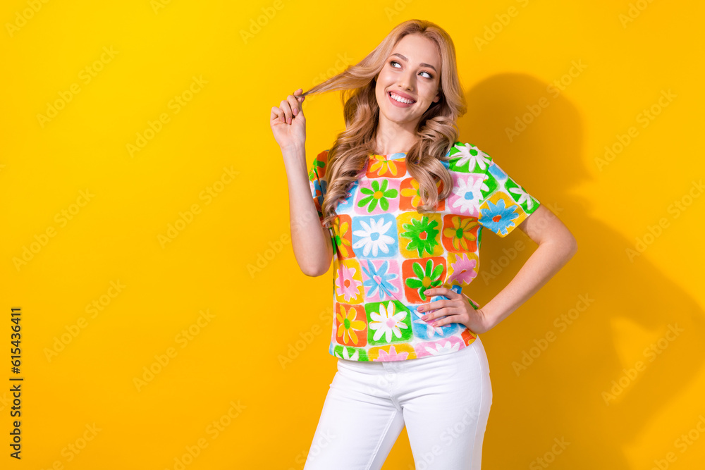 Photo of charming lady hold perfect styling wavy curl look side empty space flirty wear shirt pants isolated yellow color background Photo of charming lady hold perfect styling wavy curl look side empty space flirty wear shirt pants isolated yellow color background