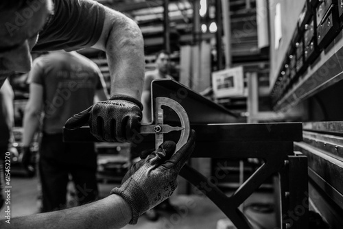 metal worker measuring the angle