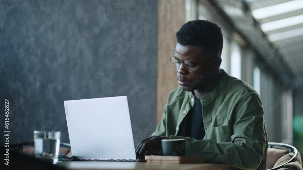 A black man with glasses is very familiar with advertising technology - he develops and runs effective advertising campaigns for his clients and projects. A black man with glasses is very familiar with advertising technology - he develops and runs effective advertising campaigns for his clients and projects.