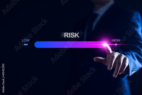 Risk management and chance to increase exposure for financial investment, projects, engineering, business. get maximum profit. Concept with manager's hand slide to high level. Fully open to risk.