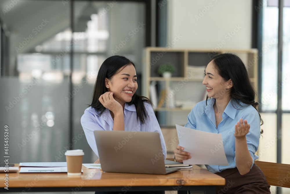 Two asian businesswoman showing joyful gesture after success in financial business. Profit. Working investment paperwork approved startup business concept. real estate project Teamwork and friendship Two asian businesswoman showing joyful gesture after success in financial business. Profit. Working investment paperwork approved startup business concept. real estate project Teamwork and friendship