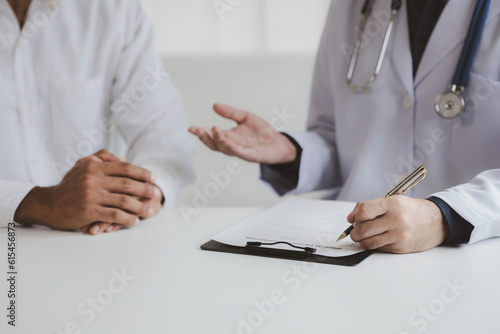 The doctor and the patient are discussing the details of the treatment  the results of the physical examination of the patient. Annual physical examination concept.