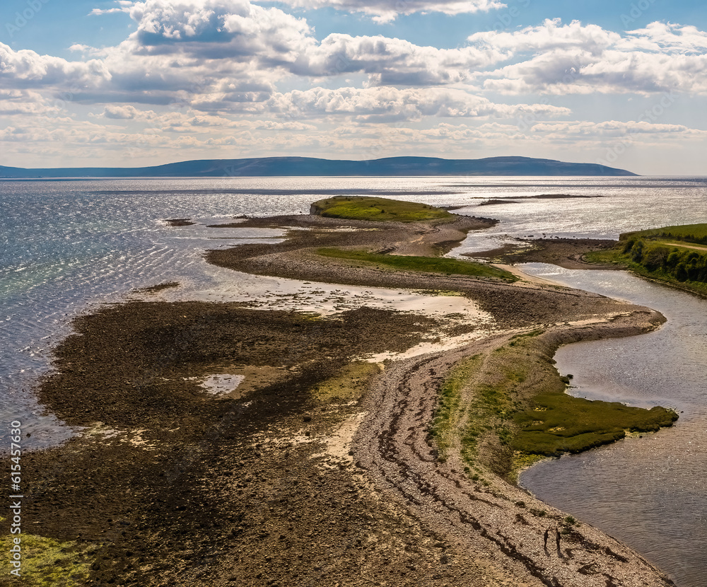 Aerial shot of prominent cliff in Salthill, Galway Bay. Walkable during low tide, offering stunning views of County Clare. Picture-perfect location