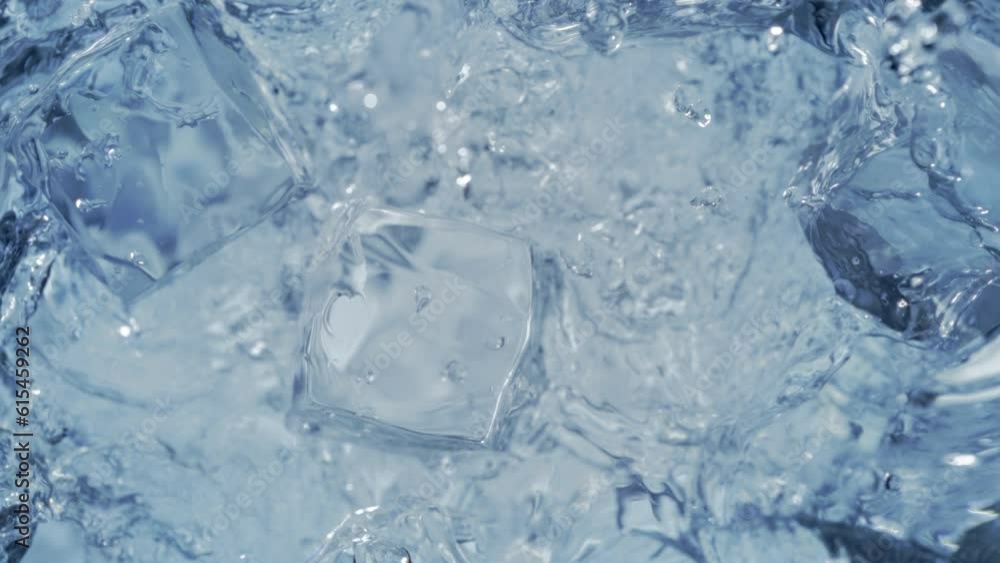 Super Slow Motion Shot of Falling and Splashing Perfect Ice Cubes into Water at 1000fps. Super Slow Motion Shot of Falling and Splashing Perfect Ice Cubes into Water at 1000fps.