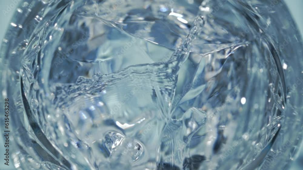 Super Slow Motion Detail Shot of Pouring Vodka on Crystal Clear Ice Cubes at 1000 fps. Super Slow Motion Detail Shot of Pouring Vodka on Crystal Clear Ice Cubes at 1000 fps.