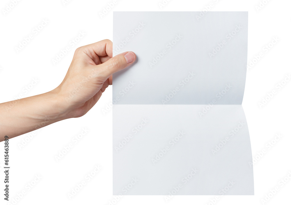 Hand holding a sheet of white paper, folded in half, cut out