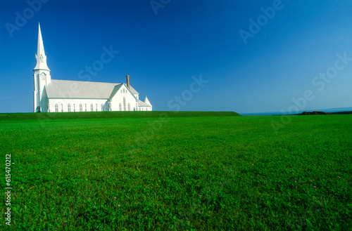 White Catholic church of Saint Pierre on Grindstone Island; Grindstone Island, Magdalen Islands, Quebec, Canada photo
