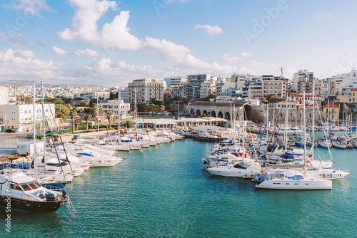 Crete, Greece - May 01, 2019: Yachts and ferry boat in the port of Heraklion. Panoramic and top view. Island of Crete, Greece