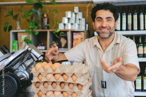 middle-aged Latin man owning an organic shop selling eggs photo