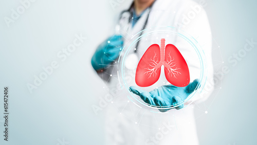 Doctor holding digital virtual human lungs for diagnostics on surgeon hand with copy space white background. Medical healthcare and organ surgery operation concept. photo