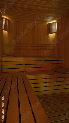 Fotografía sauna room with wooden sitting groups surrounded by wood