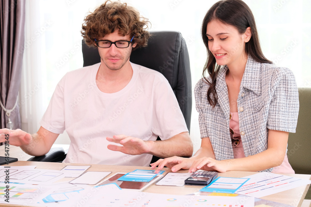 A team of smartphone application designers is choosing a design. A team of smartphone application designers is choosing a design.