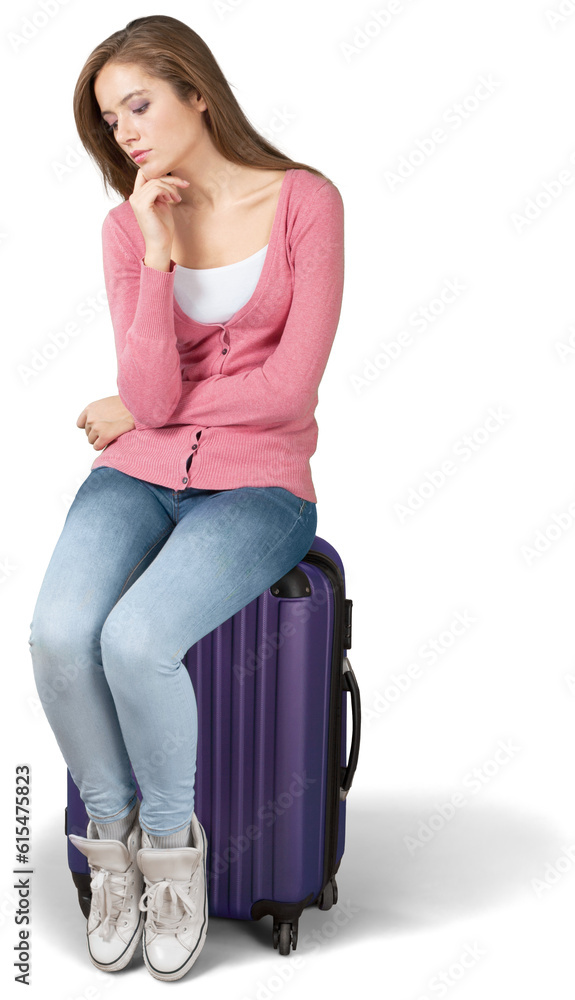Young cute woman sitting on suitcase on white background Young cute woman sitting on suitcase on white background