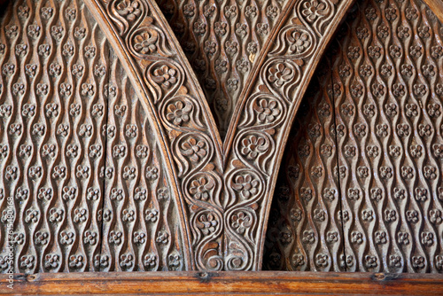 Detailed wood carving of flowers and patterns; Zanzibar photo