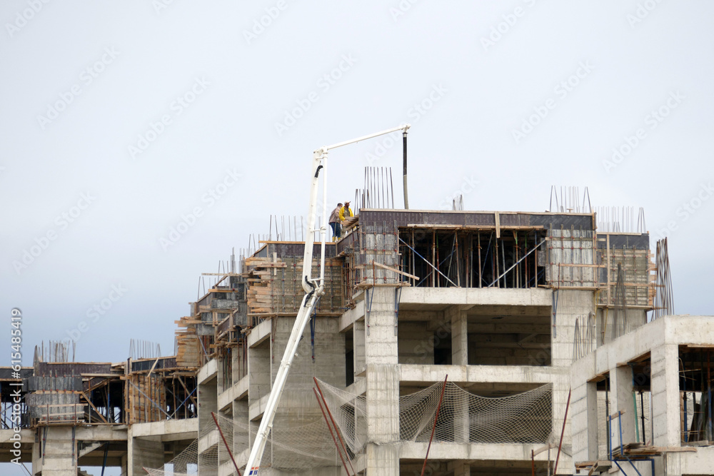 building construction and concrete mixer mortar machine is pouring concrete mortar to the construction, building construction and concrete mixer mortar machine is pouring concrete mortar to the construction,