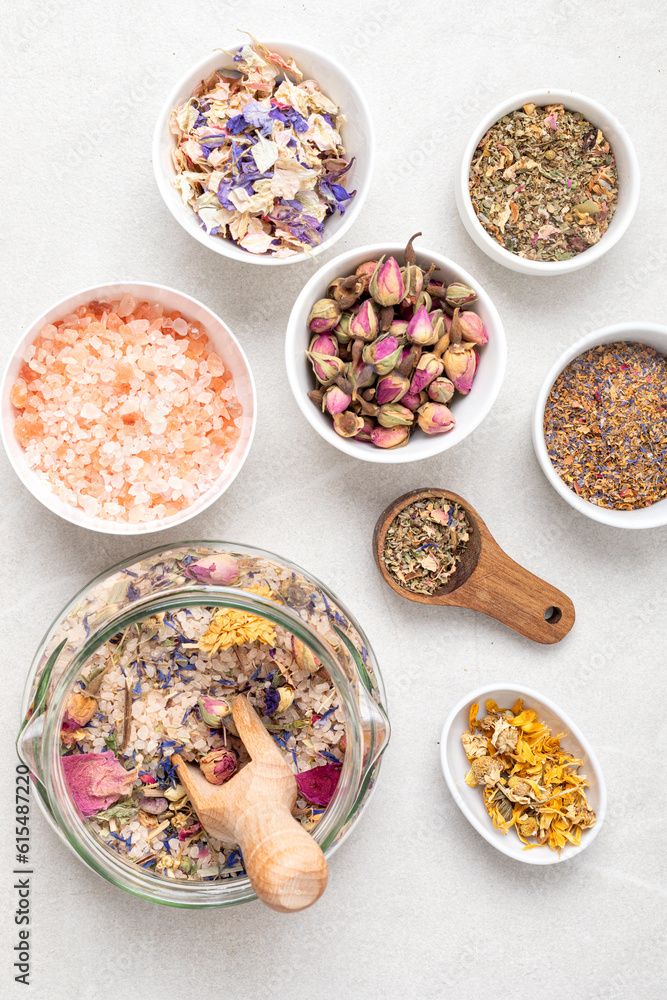 Botanical blends, salt, herbs, essencial oils for naturopathy. Natural remedy, herbal medicine, blends for bath and tea on wooden table background Botanical blends, salt, herbs, essencial oils for naturopathy. Natural remedy, herbal medicine, blends for bath and tea on wooden table background