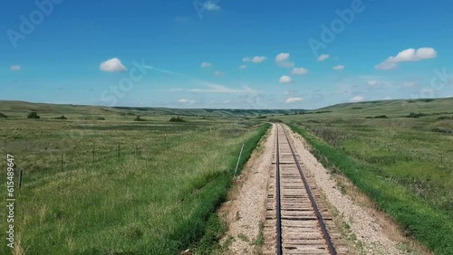 Vast Prairie  Landscape Under Expansive Horizon With Railroad   photo