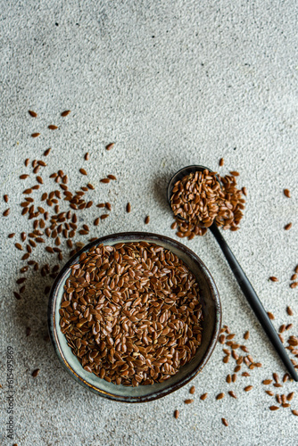 Bowl with oragnic flax seeds photo