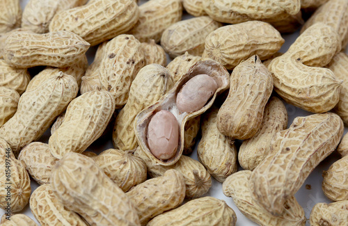 Bunch peanuts on a white background close-up. Macro photography of peanuts.