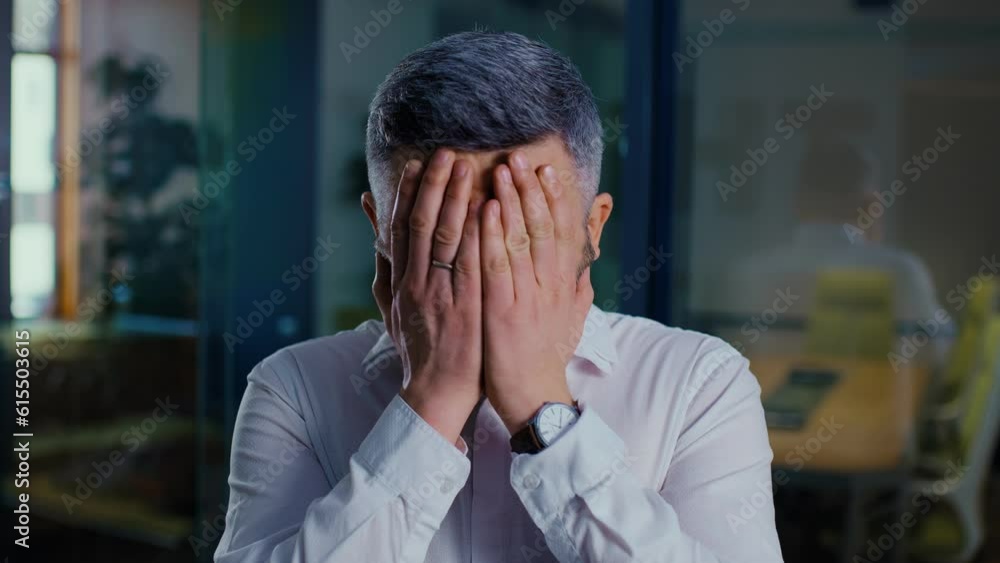 Caucasian businessman is tired and feels stressed out in the office Caucasian businessman is tired and feels stressed out in the office