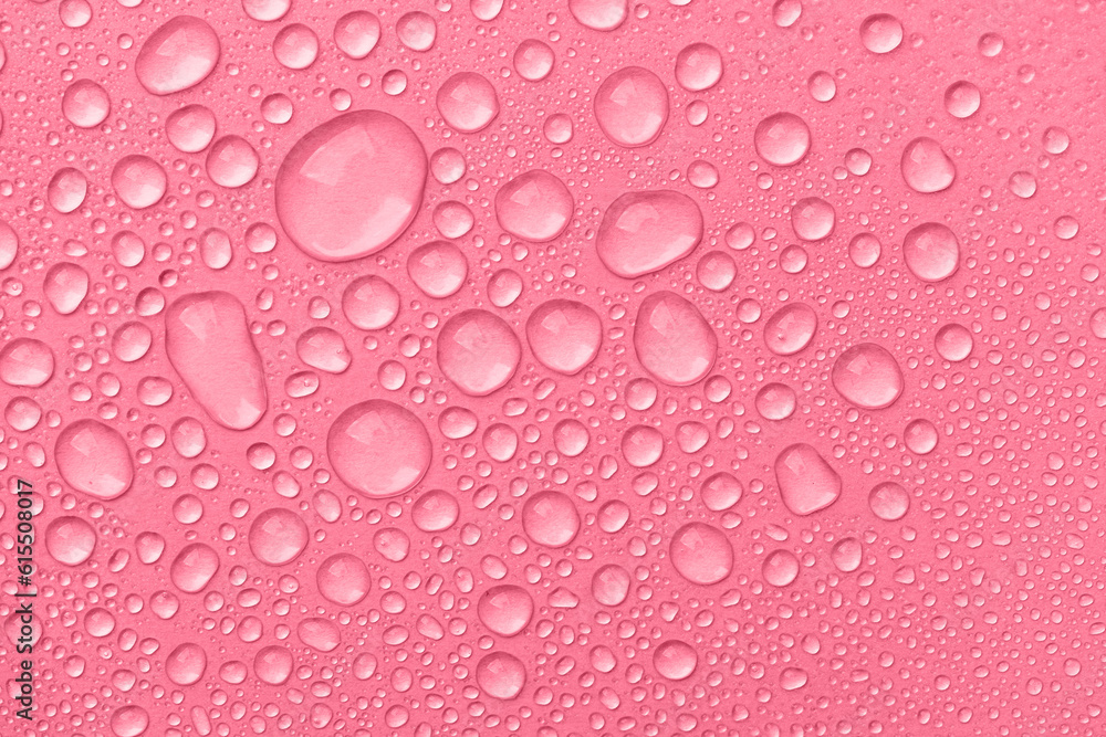 Water drops on pink background top view. Cosmetic moisturizing liquid drops of toner or hyaluronic serum. Water drops on pink background top view. Cosmetic moisturizing liquid drops of toner or hyaluronic serum.