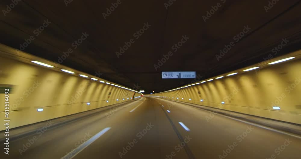 Speedy car driving in tunnel. Amazing motion of the night drive in Paris. Driving a car in the city at night. Camera in the car. Evening in the center of the city in tunnel Speedy car driving in tunnel. Amazing motion of the night drive in Paris. Driving a car in the city at night. Camera in the car. Evening in the center of the city in tunnel
