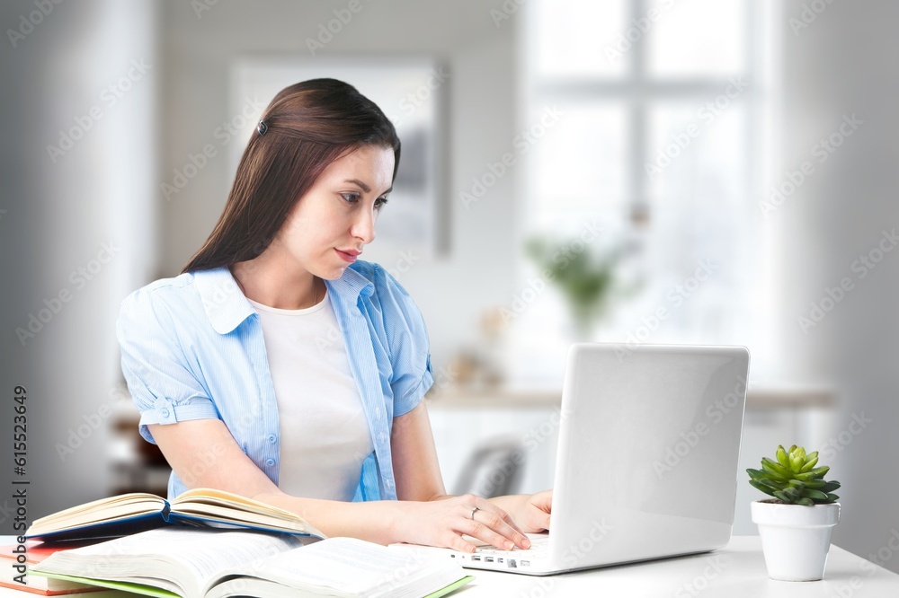 Young smiling business person or student work on computer Young smiling business person or student work on computer