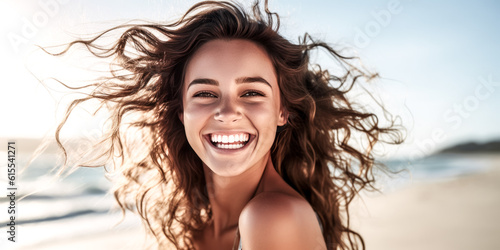 A happy young woman smiles, glowing with joy.