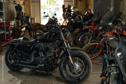 Creative authentic motorcycle workshop many different motorcycles are standing in the garage
