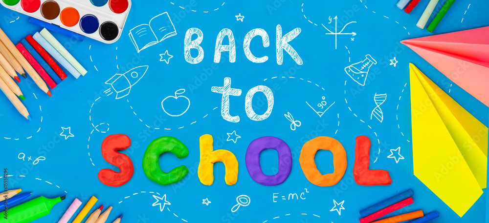 Back to school background. Top view flat lay concept. Childish lettering, colored paper, supplies, stationery for primary school, elementary school or grade school or preschool educational Back to school background. Top view flat lay concept. Childish lettering, colored paper, supplies, stationery for primary school, elementary school or grade school or preschool educational