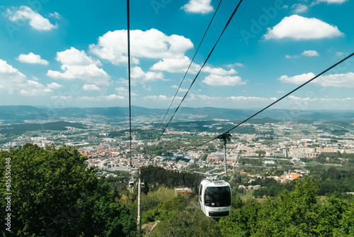 Guimaraes, Portugal. April 14, 2022: Panoramic of Guimaraes and cable car of the city with beautiful blue sky.