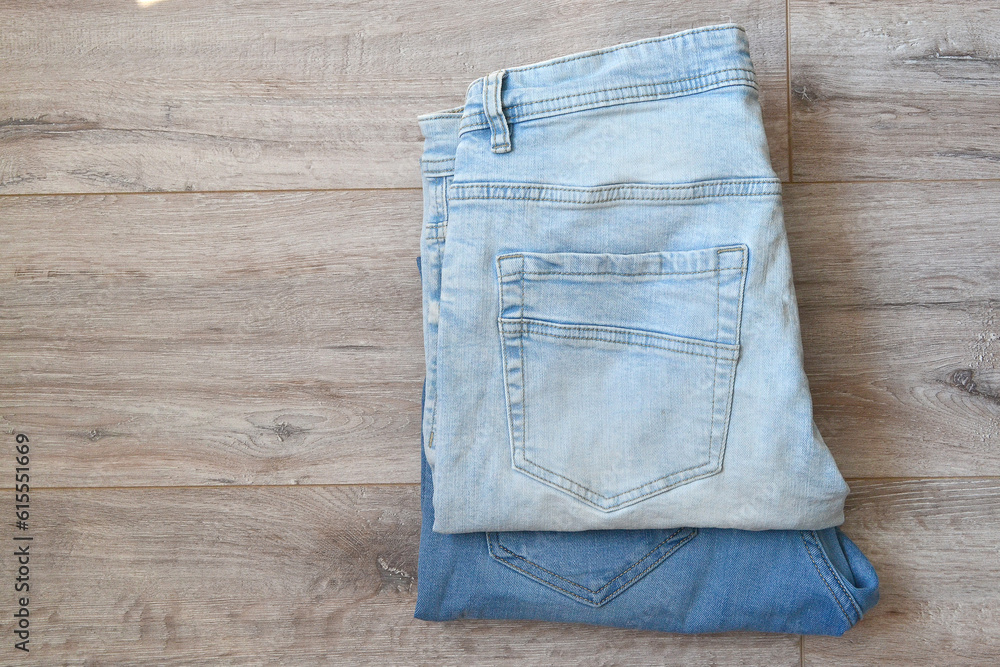 two pairs of jeans lie on the floor two pairs of jeans lie on the floor